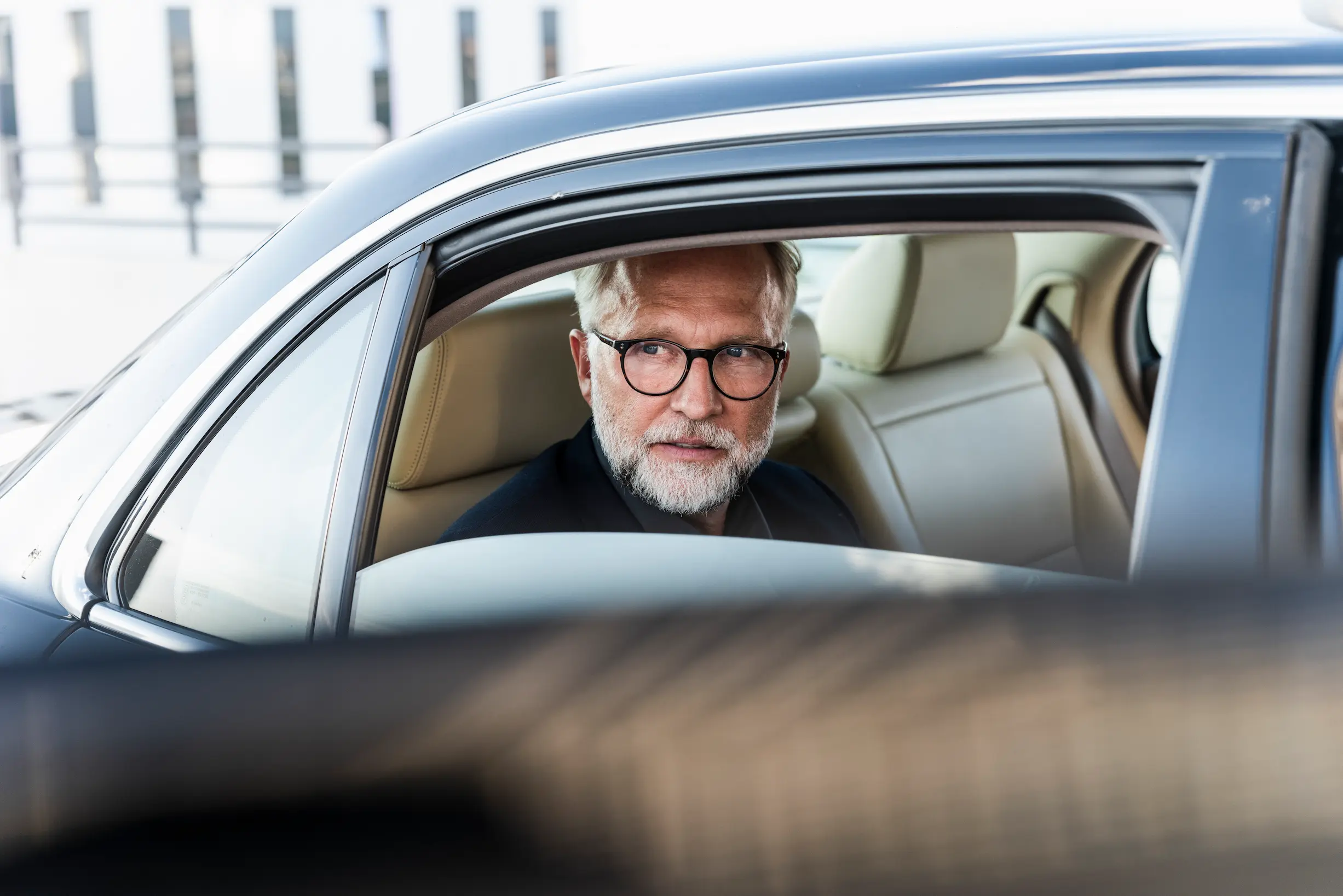 Executive passenger in premium airport transfer car